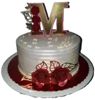 a white cake with red roses and a letter m on top