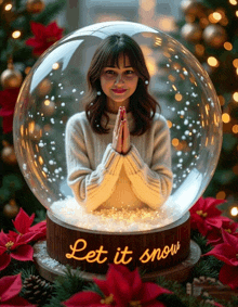 a woman in a snow globe with the words let it snow on it