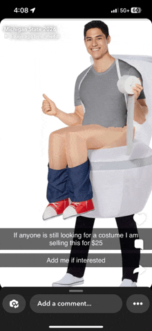 a man is sitting on a toilet with a roll of toilet paper in his hand