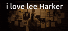 a woman stands in front of a bulletin board with the words i love lee harker on it