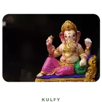 a statue of ganesha is sitting on a couch with the word kulfy below it