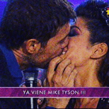 a man and a woman kissing with the words ya viene mike tyson !!!