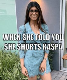 a woman in a blue dress stands in front of a building with a caption that says when she told you she shorts kaspa