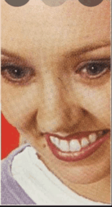 a close up of a woman 's face with red lips