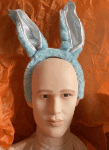 a mannequin is wearing a headband with bunny ears