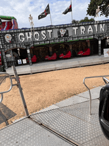 a ghost train ride at a carnival with a skeleton on top of it