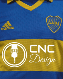 a blue and yellow adidas shirt with cnc design on the bottom