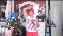 a woman in an american flag shirt is dancing in a bedroom