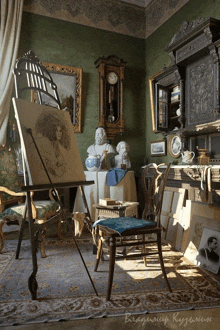 a painting on an easel in a room with vladimir kuzmin written on the floor