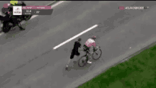 a person is riding a bike on a road .