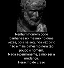 a statue of a man with a beard and a quote from heraclito de efeso