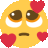 a yellow smiley face with red hearts on it 's face .