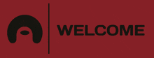 a red welcome sign with a black circle in the middle