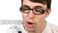 a man wearing glasses says " boobs " in white letters