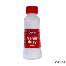 a bottle with a red label that says ' agam nahar duzy ' on it