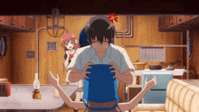 a man is holding a blue bucket in his hands while a girl looks on