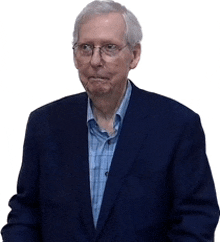 an older man wearing glasses and a blue suit is standing in front of a white background .