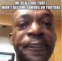 a man is crying with tears coming out of his eyes while making a meme about not becoming famous on youtube .