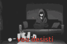 a black and white image of a person laying on a couch with the words vou desisti in red