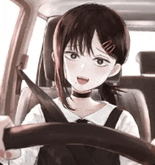 a girl is sitting in the driver 's seat of a car wearing a seat belt .