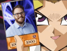 a man with glasses is holding up a card that says 1000