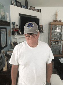 a man wearing a hat with a patch that says ' united states navy ' on it