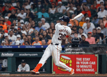 a baseball player with the number 30 on his shirt