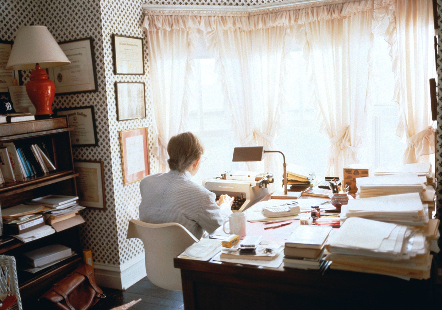 This image may contain Human Person Furniture Table Chair Desk and Indoors