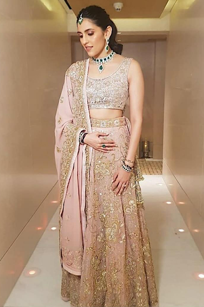 Shloka-Ambani-in-pastel-pink-Abu-Jani-Sandeep-Khosla-lehenga-and-backless-blouse-with-diamond-jewellery-crop