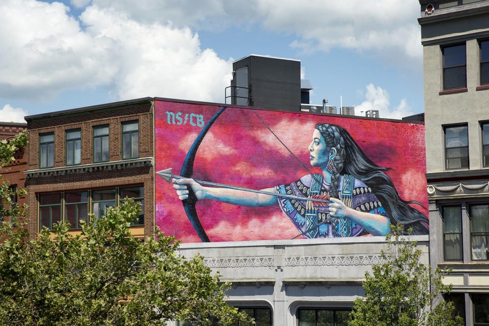 Nicole Salgar and Chuck Berrett's mural in Cental Square, Lynn. (Robin Lubbock/WBUR)