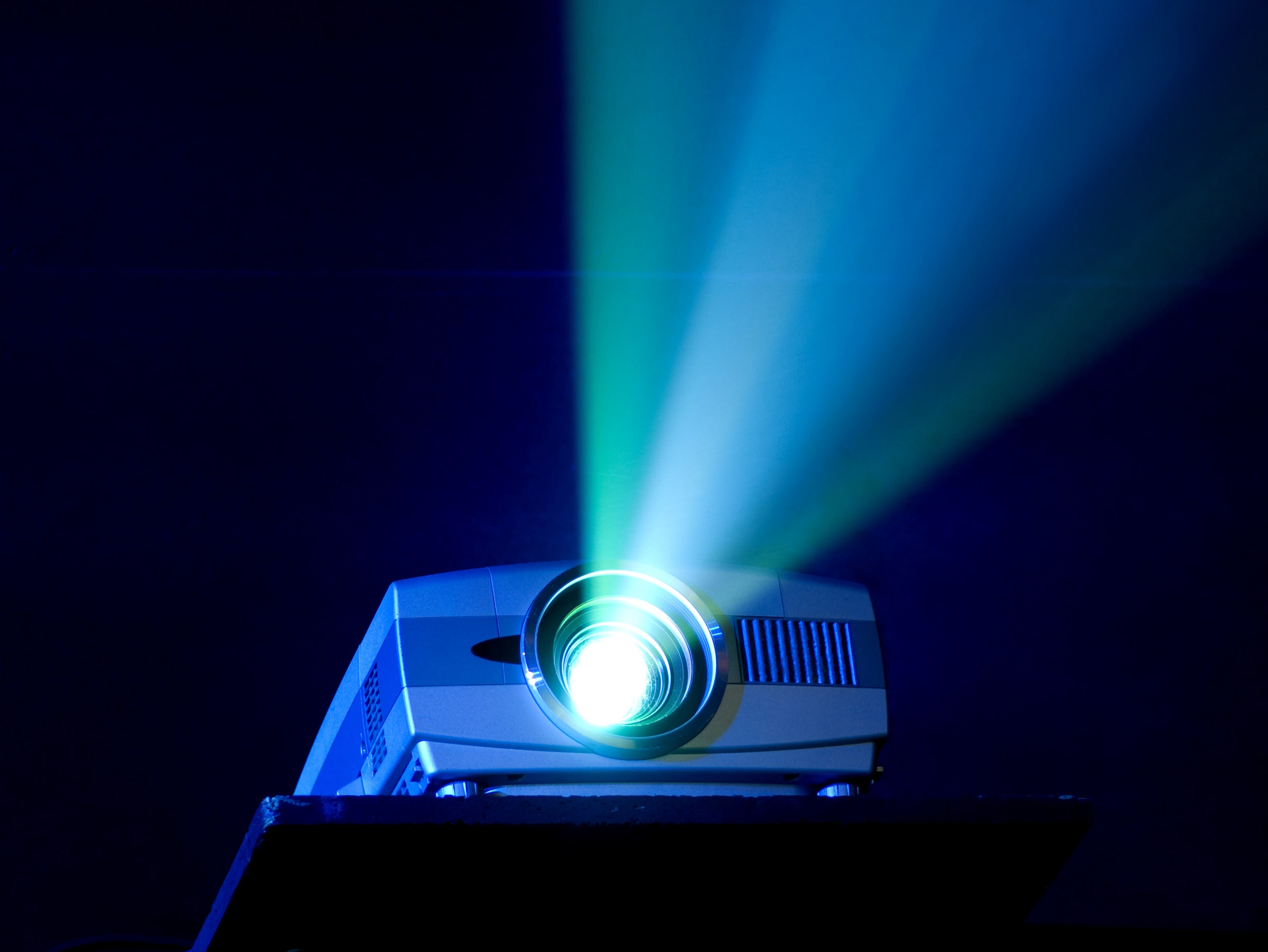 Projector illuminating light in dark room