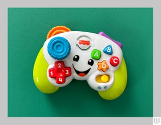 Fisher Price Game and Learn Controller a brightly colored toy shaped like  video game controller with a joystick and...