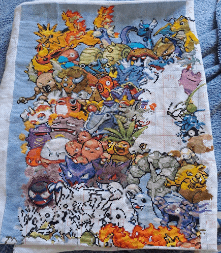 a cross stitch of pokemon characters on a blue background