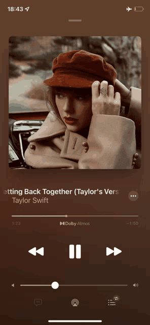 getting back together by taylor swift is playing on a phone