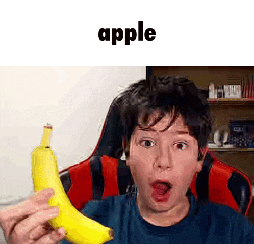 a man is holding a banana with his mouth open and the word apple is above him