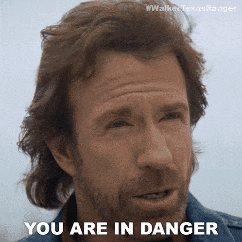 a close up of a man 's face with the words " you are in danger "