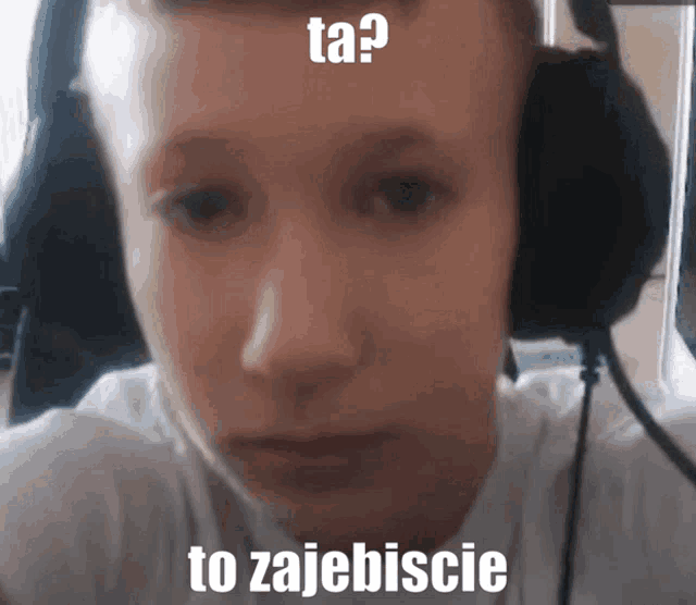 a young man wearing headphones with a caption that says ta