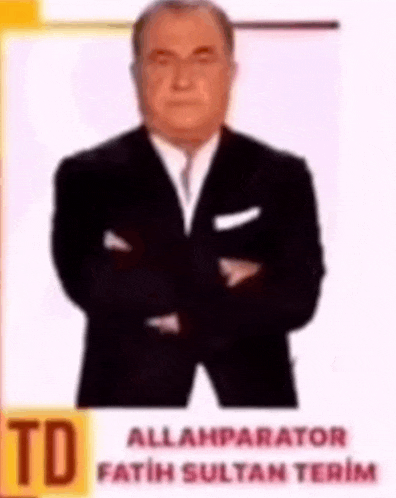 a man in a suit and tie is standing with his arms crossed and says allahparator fatih sultan terim