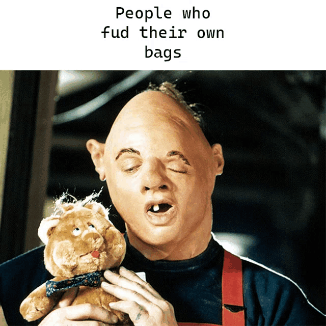 a man holding a stuffed animal with the words people who fud their own bags above him