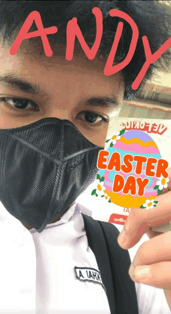 a man wearing a mask holds a sticker that says easter day