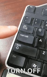 a person is pressing the shift key on a keyboard with the words turn off below it