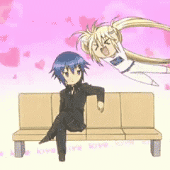 a boy and a girl are sitting on a bench