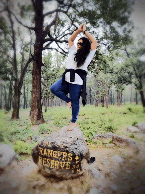 a woman stands on a rock that says ranger 's reserve