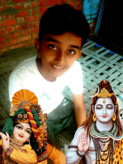 a young boy sitting next to a picture of shiva and a picture of krishna