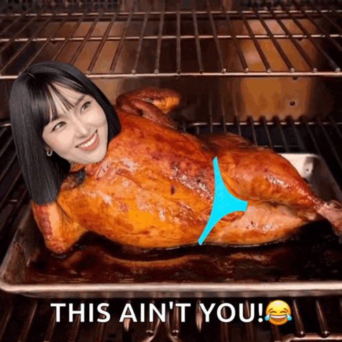 a picture of a woman laying on top of a roasted chicken with the caption this ain 't you