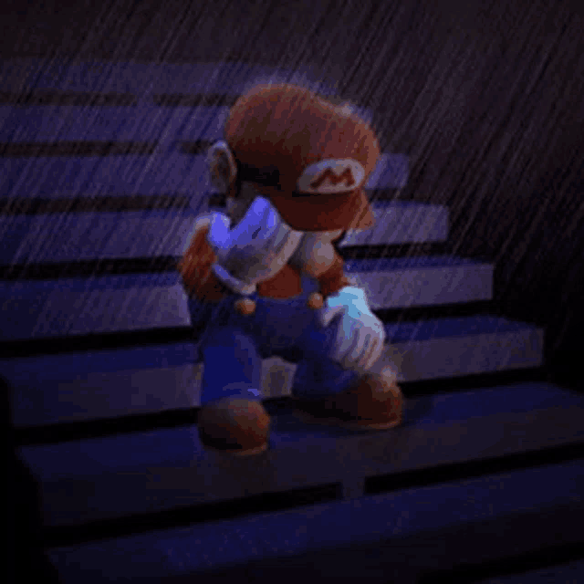 mario is sitting on the stairs in the rain covering his face .