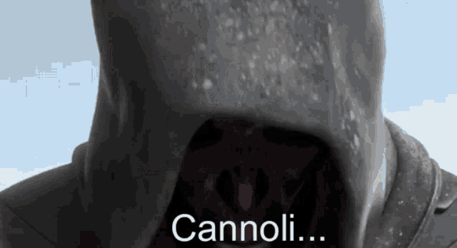 a close up of a person 's face with the word cannoli written on it