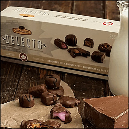 a box of ganong assorted milk chocolates sits on a table