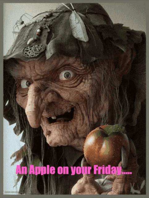 a picture of a witch holding an apple with the words an apple on your friday below her