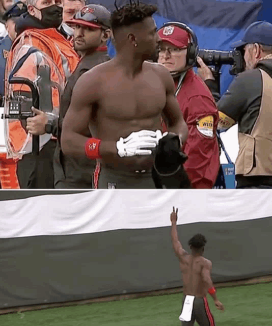 a man without a shirt is standing on a football field with a cameraman behind him